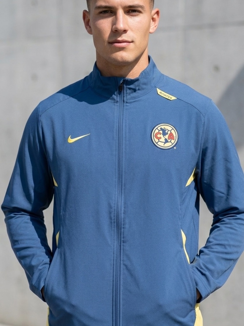 Nike Blue Jacket with Yellow and Red Emblem